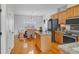 Well-lit kitchen with stainless steel appliances, granite countertops, and a dining area at 2116 Tidal Cv, Lawrenceville, GA 30043