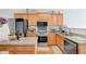 Charming kitchen with stainless steel appliances, granite countertops, and hardwood floors at 2116 Tidal Cv, Lawrenceville, GA 30043