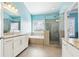 Bathroom with a large soaking tub, walk-in shower, and granite vanity at 2445 Santa Rosa St, Alpharetta, GA 30009