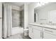 Clean bathroom with granite countertop, white cabinets, and a shower/tub combo at 2445 Santa Rosa St, Alpharetta, GA 30009