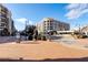 Open community plaza with a building and street view at 2445 Santa Rosa St, Alpharetta, GA 30009