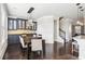 Spacious dining area with dark hardwood floors and a view of the kitchen at 2445 Santa Rosa St, Alpharetta, GA 30009