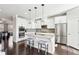 Eat-in kitchen with white cabinetry, granite island, and stainless steel appliances at 2445 Santa Rosa St, Alpharetta, GA 30009