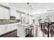 Modern kitchen with white cabinets, granite countertops, and stainless steel appliances at 2445 Santa Rosa St, Alpharetta, GA 30009