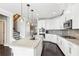 Modern kitchen boasting white cabinets, granite countertops and a large island at 2445 Santa Rosa St, Alpharetta, GA 30009