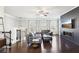 Open living area with a stylish fireplace, hardwood floors, and a sectional sofa at 2445 Santa Rosa St, Alpharetta, GA 30009