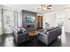 Modern living room featuring a gray accent wall with a fireplace and built-in shelving at 2445 Santa Rosa St, Alpharetta, GA 30009
