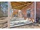 Brick patio with covered area and access to backyard at 2445 Santa Rosa St, Alpharetta, GA 30009