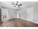 Spacious bedroom with hardwood floors and ceiling fan at 85 Hickory Dr, Stockbridge, GA 30281
