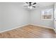 Bright bedroom with wood-look floors and a ceiling fan at 85 Hickory Dr, Stockbridge, GA 30281