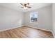 Well-lit bedroom with wood-look floors and a ceiling fan at 85 Hickory Dr, Stockbridge, GA 30281