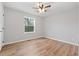 Bright bedroom with wood-look floors and a ceiling fan at 85 Hickory Dr, Stockbridge, GA 30281