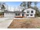Newly renovated farmhouse-style home with a charming front porch at 85 Hickory Dr, Stockbridge, GA 30281