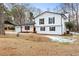 Two-story white house with a spacious yard and mature trees at 85 Hickory Dr, Stockbridge, GA 30281