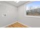 Bright laundry room featuring built-in shelving and vinyl flooring at 85 Hickory Dr, Stockbridge, GA 30281