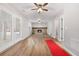 Open living area with hardwood floors, stone fireplace, and French doors at 85 Hickory Dr, Stockbridge, GA 30281