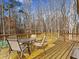 Spacious wooden deck furnished with a glass table and chairs, perfect for outdoor relaxation at 5295 Ridge Rd, Douglasville, GA 30134