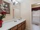 Bathroom featuring a vanity with drawers, a large mirror, and a shower with glass doors at 5295 Ridge Rd, Douglasville, GA 30134