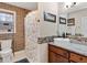 Bathroom features a brick wall, a granite countertop, and a shower with a floral curtain at 5295 Ridge Rd, Douglasville, GA 30134