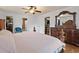 This spacious bedroom includes a walk-in closet, an ensuite bathroom, and a ceiling fan at 5295 Ridge Rd, Douglasville, GA 30134