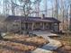 Ranch house with stone exterior, large deck, and walkway at 5295 Ridge Rd, Douglasville, GA 30134