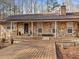 Charming stone-clad home with a spacious wooden front deck and inviting entrance at 5295 Ridge Rd, Douglasville, GA 30134