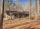 Beautiful stone home nestled among the trees with a large front porch and welcoming entrance at 5295 Ridge Rd, Douglasville, GA 30134