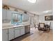 Spacious eat-in kitchen with gray cabinetry, stainless steel appliances, and backyard views at 5295 Ridge Rd, Douglasville, GA 30134