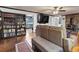 Cozy living room featuring hardwood floors, a built-in bookshelf, and access to the kitchen at 5295 Ridge Rd, Douglasville, GA 30134
