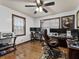 Home office with wood floors, multiple monitors, and natural light from two windows at 5295 Ridge Rd, Douglasville, GA 30134
