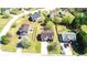 Aerial view of a suburban home with a fenced backyard and lush landscaping, and a long driveway at 8504 Browns Mill Trce, Lithonia, GA 30038