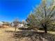 Backyard showcasing mature trees, a playset, and ample space for outdoor activities at 8504 Browns Mill Trce, Lithonia, GA 30038