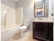 Bathroom with shower-tub combo, tile floor, and single sink vanity at 8504 Browns Mill Trce, Lithonia, GA 30038