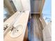 Well-lit bathroom showcasing a double vanity, and a separate soaking tub at 8504 Browns Mill Trce, Lithonia, GA 30038