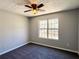 Bedroom featuring neutral paint, new carpet and trim at 8504 Browns Mill Trce, Lithonia, GA 30038