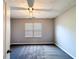 Bedroom with carpet, a ceiling fan, and a window with horizontal blinds at 8504 Browns Mill Trce, Lithonia, GA 30038