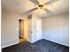 Bedroom with carpet, ceiling fan, and two closets at 8504 Browns Mill Trce, Lithonia, GA 30038