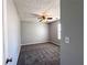Cozy bedroom with neutral walls, carpet, and a ceiling fan at 8504 Browns Mill Trce, Lithonia, GA 30038