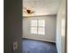 Bedroom with new carpet, fan, and fresh paint at 8504 Browns Mill Trce, Lithonia, GA 30038