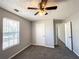 Bedroom featuring neutral walls, carpeting, a window, and white trim at 8504 Browns Mill Trce, Lithonia, GA 30038