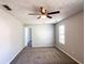 Bedroom with carpet, a ceiling fan, and a window with horizontal blinds at 8504 Browns Mill Trce, Lithonia, GA 30038