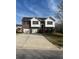 Charming two-story home featuring a brick facade, attached two-car garage, and well-maintained front yard at 8504 Browns Mill Trce, Lithonia, GA 30038