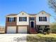 Beautiful two-story home with a two car garage, brick facade, and a well manicured lawn and garden at 8504 Browns Mill Trce, Lithonia, GA 30038