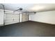 Clean garage with epoxy flooring and two garage doors at 8504 Browns Mill Trce, Lithonia, GA 30038
