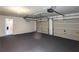 Clean garage with epoxy flooring and two garage doors at 8504 Browns Mill Trce, Lithonia, GA 30038