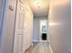 Hallway with a linen closet leading to a bathroom at 8504 Browns Mill Trce, Lithonia, GA 30038
