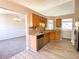 Open-concept kitchen with stainless steel appliances and a view to the adjacent living spaces at 8504 Browns Mill Trce, Lithonia, GA 30038