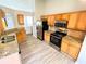 Modern kitchen with stainless steel appliances, granite countertops, and hardwood floors at 8504 Browns Mill Trce, Lithonia, GA 30038