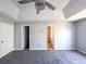 Bedroom with new carpet, fan, and fresh paint at 8504 Browns Mill Trce, Lithonia, GA 30038