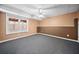 Spacious finished basement with neutral carpeting and large window at 902 College Place Nw Ct, Kennesaw, GA 30144